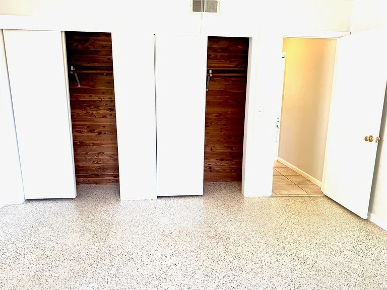 Bedroom #1 with two double cedar closets. Terazzo floors.