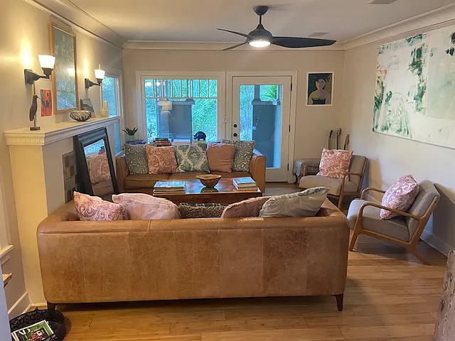 Light-filled living room overlooking meadow
