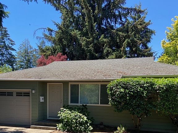 Attractive hip roof adds to the look of this classic mid century modern home.