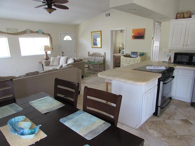 Kitchen is fully equipped. An abundance of natural light and raised ceilings provide an open and airy interior.