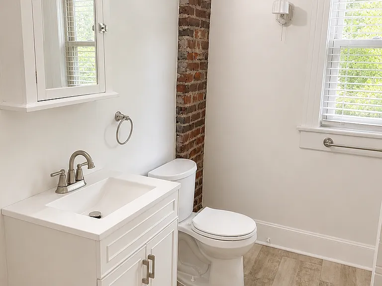 Recently renovated bathroom with subway tile.