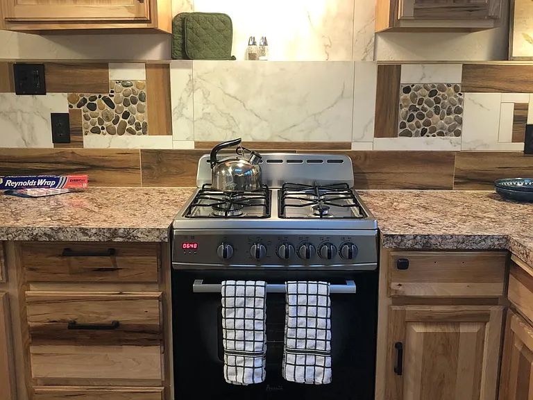 This is a small apartment size stove but it is propane and there is a microwave