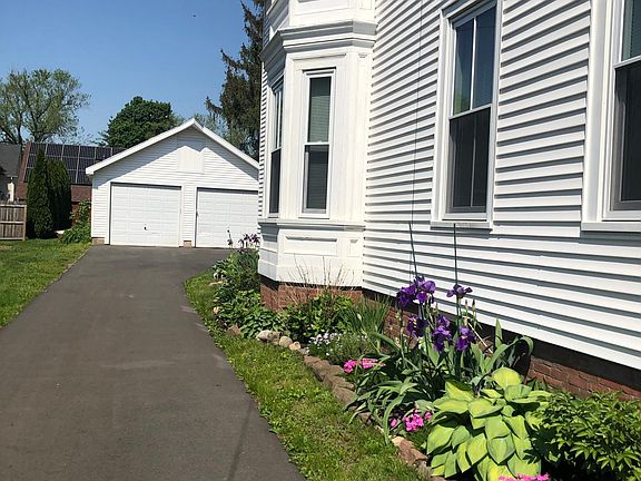 Two parking spots in the driveway behind the house
