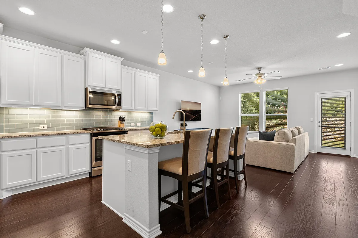 Open floorplan features kitchen and living room - 14102 McCoy Loop