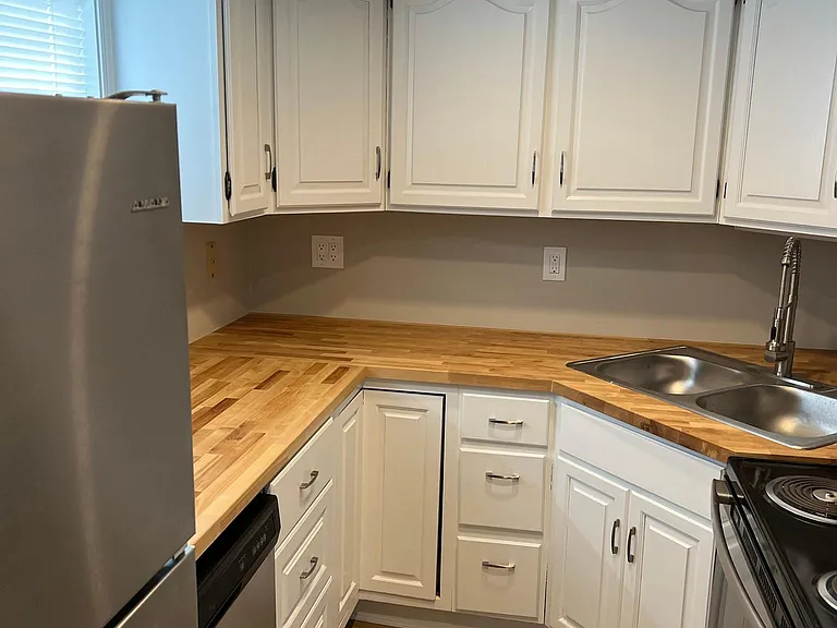 Updated kitchen with new appliances , dishwasher, and countertops.