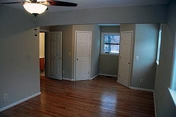 Master bedroom with his and hers closets