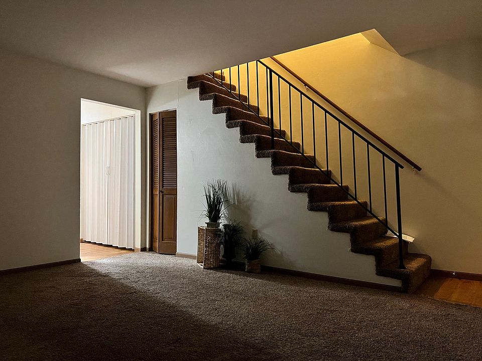 after you walk into the front door you see this living too , storage under steps , laundry washer and dryer hook up , then you will walk into half bath on left and then kitchen