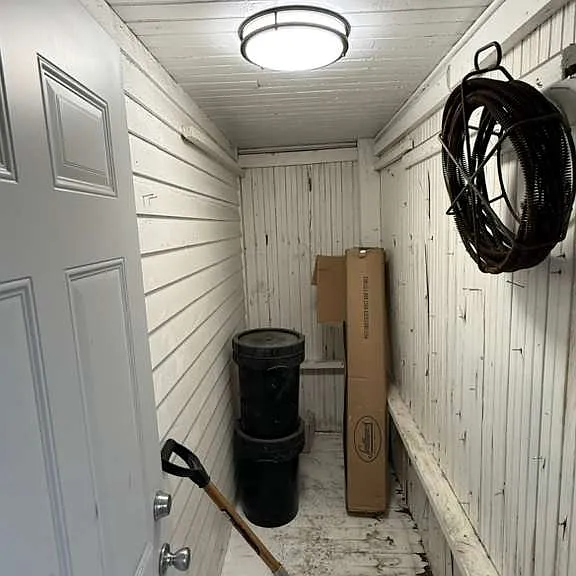 Storage shed accessibkle from the Back facing Porch.