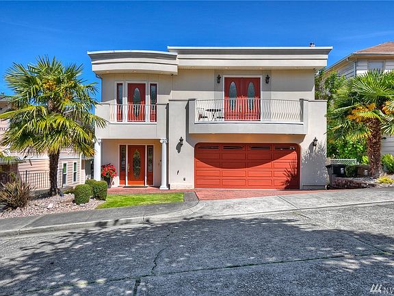The attractive facade is flanked by Palm Trees, providing a welcoming tropical vibe.