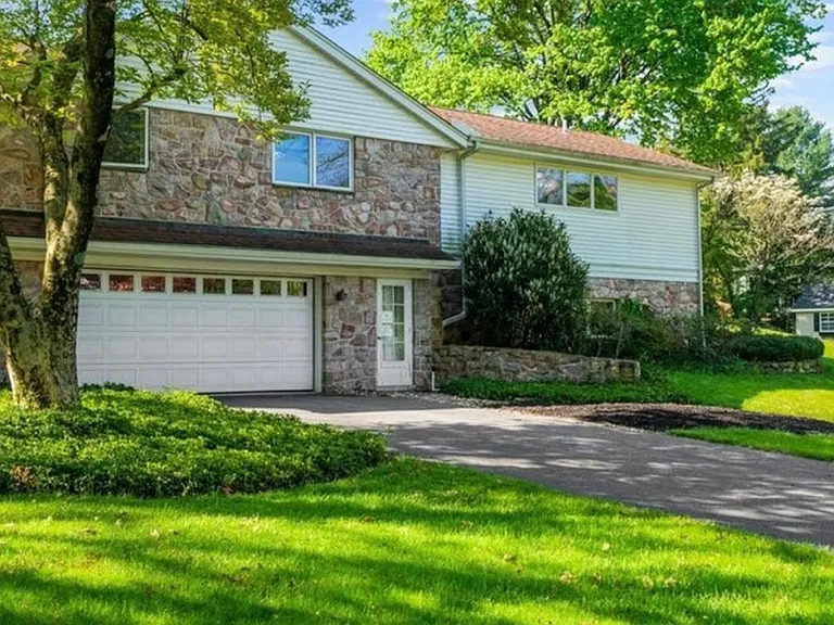 2 Car garage on side of house. There is an additional garage in the front of house! Yes, parking GALORE.
