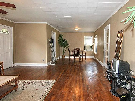 Another view looking from the hall leading to the bedrooms back towards the dining room.