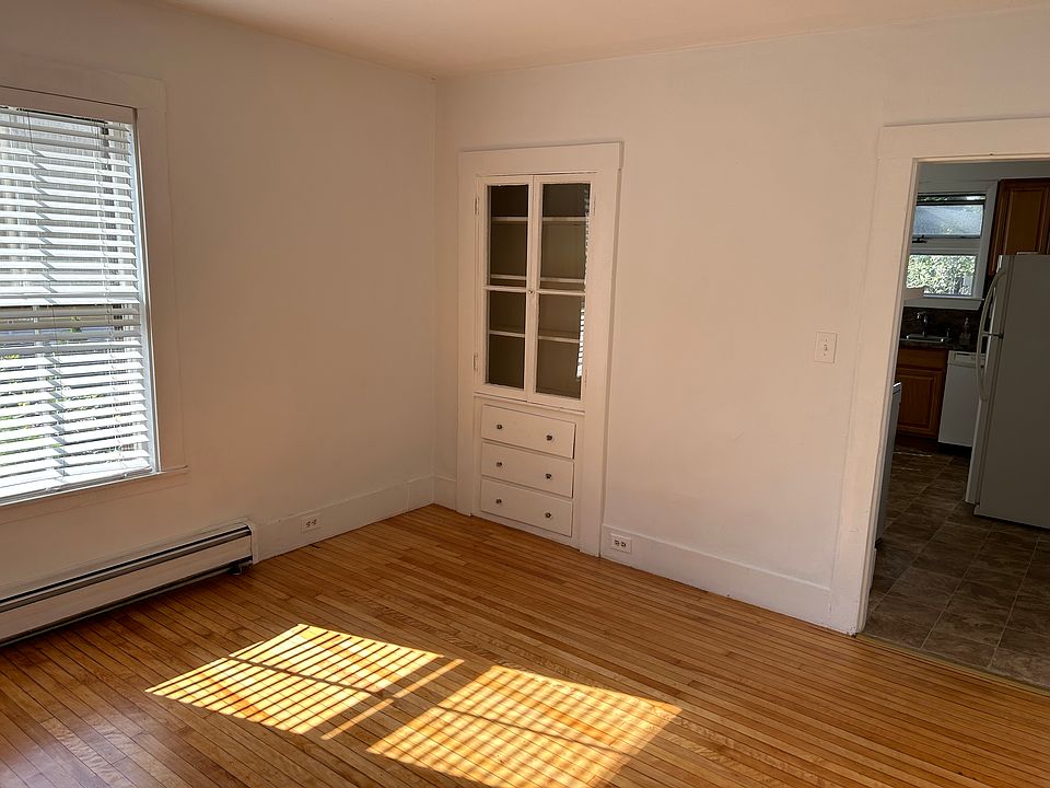 Living room includes built in cabinet.