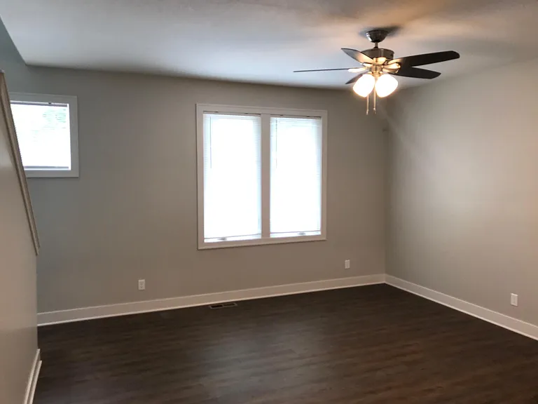 1st floor Living Room. Stairs to 2nd floor to left