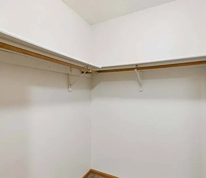 Designed with room to grow, this spacious walk-in closet keeps your wardrobe organized while offering plenty of space for every season.