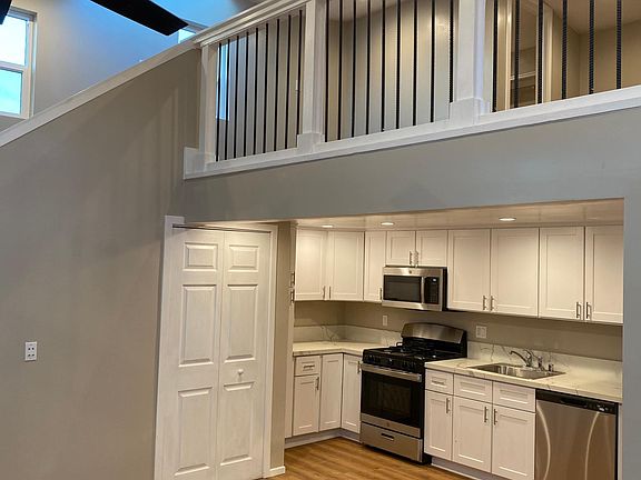 downstairs - kitchen, laundry, bathroom, living space