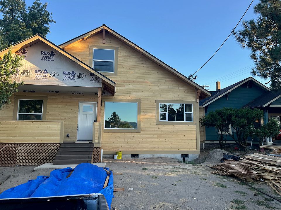 Exterior teal paint coming soon. Yard will eventually be fenced in. New tenant can have input on landscaping and is encouraged to garden. Porch with views of Grizzly Peak.