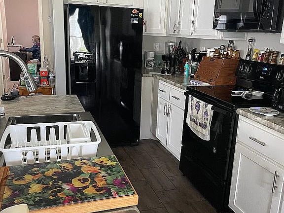 Kitchen with farmhouse sink.