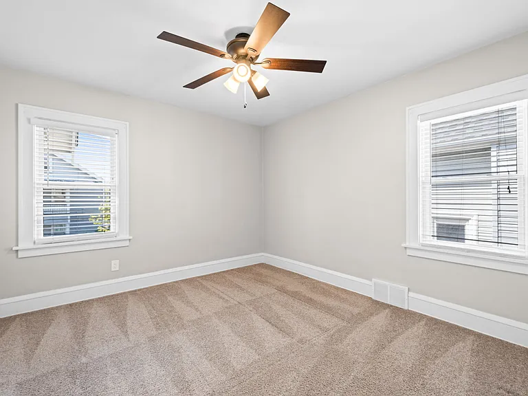 This photo shows one of the two bedrooms on the second/main floor of the unit.