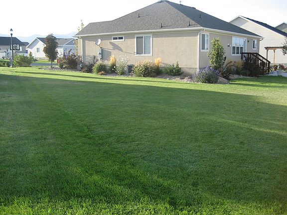 HUGE side and backyards with incredible lawn