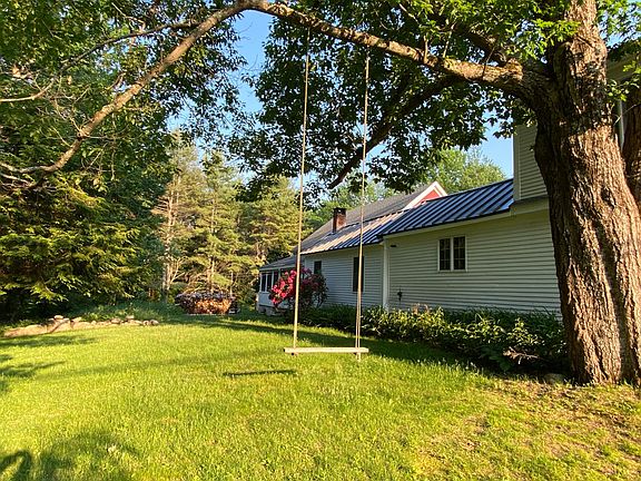 Side yard view with swing