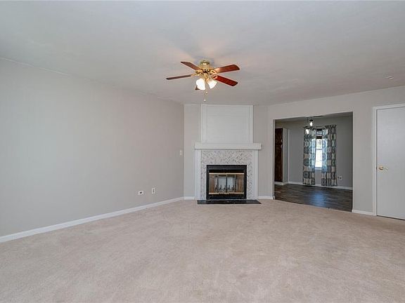 Living room with wood burning fire place