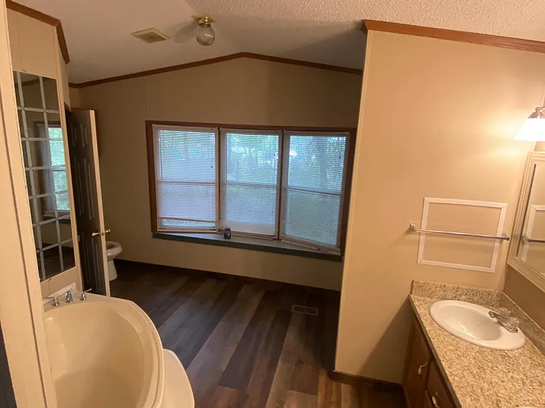 Master bathroom with shower, tub, 2 vanities and walk in closet.