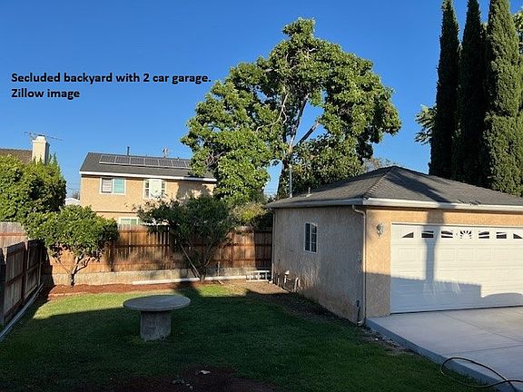 Private Backyard with detached 2 car garage.