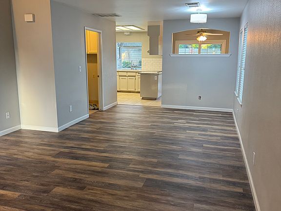 Living Room showing entry into the laundry room and the 1/2 bath