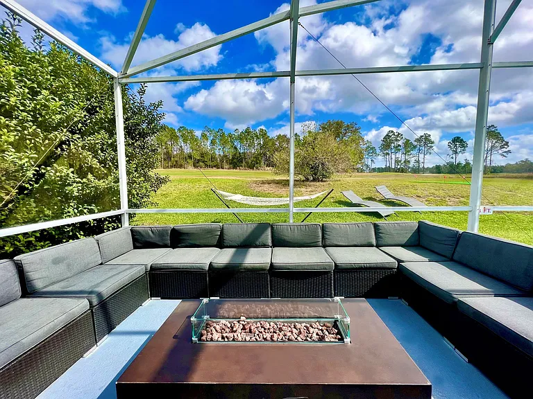 Outdoor Dining - Host exclusive private chef dinners for up to 24 guests outside and 20 inside, complemented by Philip Starck designed chairs. Enjoy scenic views of the private pool, golf course, and unwind by the Fire Pit with a cocktail.