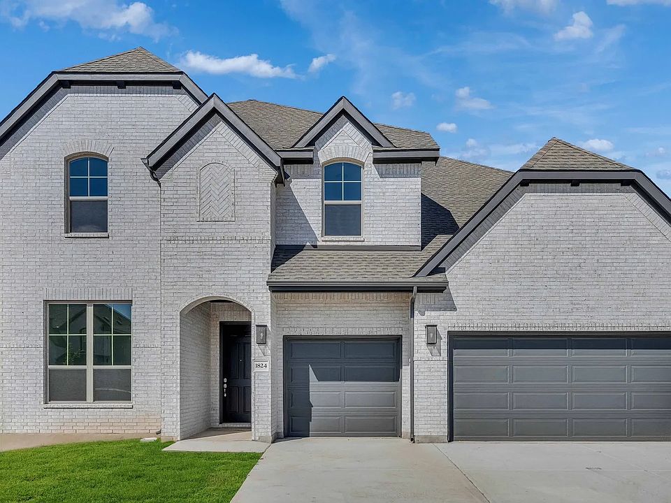 Elegant brick facade with dual garage classic gabled roof design. Situated in Dartmouth s prestigio