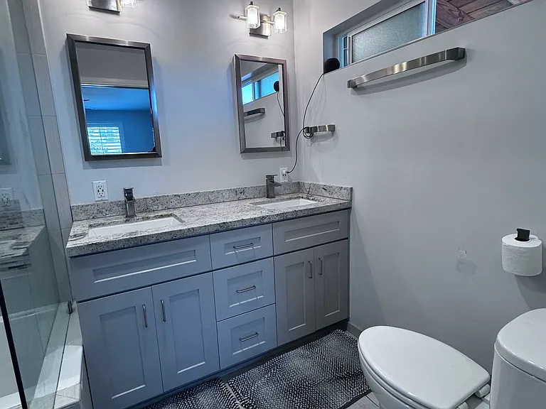 Master bathroom features double sinks and a combo soaking tub/shower.