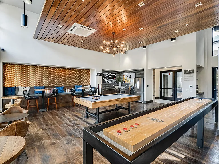 Challenge friends in our game room featuring billiards and shuffleboard