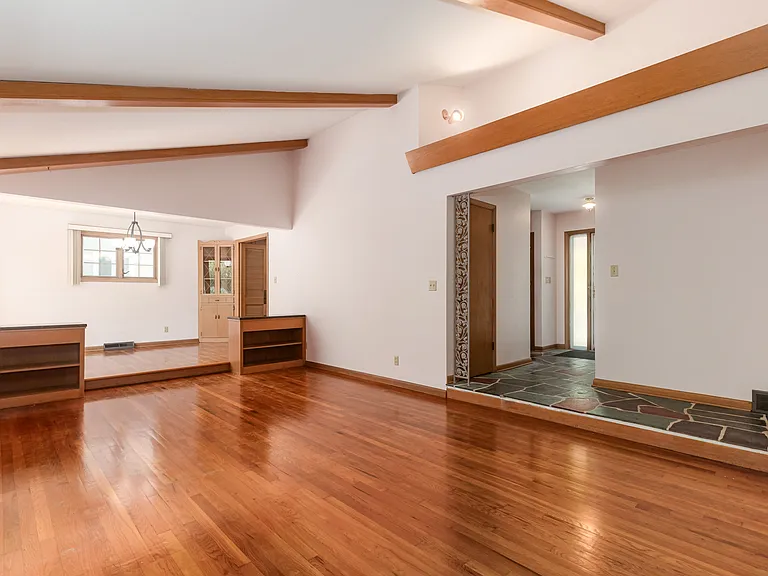 Living room view with pristine natural hardwood floors