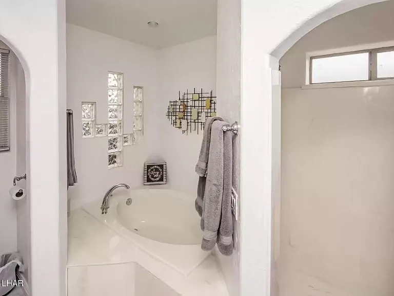 Large soaking tub and shower.