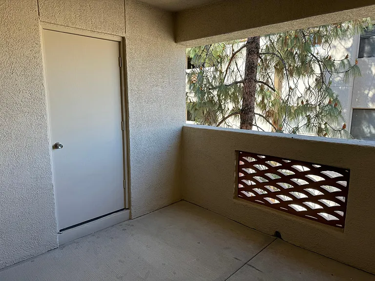 Balcony is peaceful and roomy. Have a drink with friends, nap, or grab a book and tea. Door leads to outdoor storage space.
