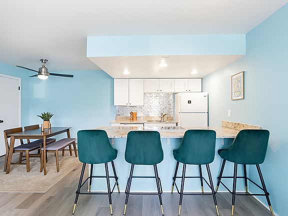 Gather Around the Heart of the Home. Whether it's morning coffee at the bar or dinner with friends at the table, this open-concept space makes every meal feel like a shared moment.