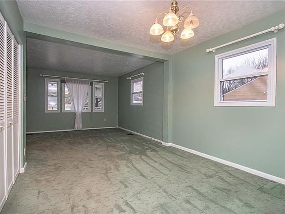 From the kitchen, you can see that the dining room opens to the living room creating a nice open space. On the left is the laund