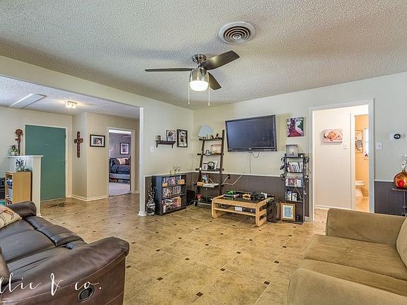 Door to right of front door enters master bedroom.  Doorway on right is access to bedroom #2 & #3 - plus guest bath.