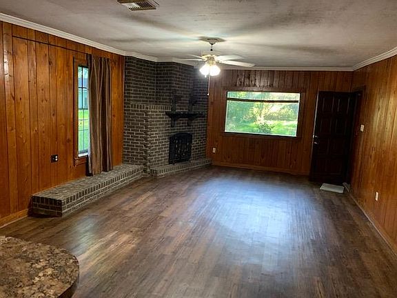 Living area with non working fireplace.