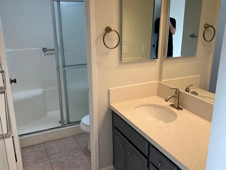 Primary room sink and shower stall