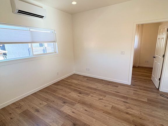 Living area with entry way to bedroom