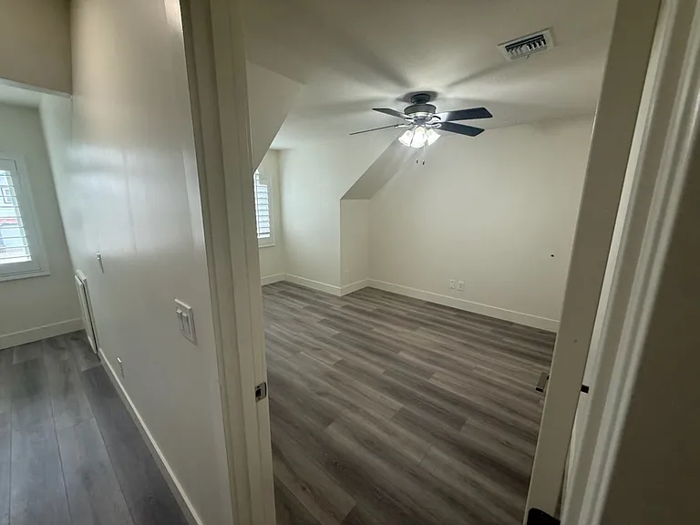 This is one of 3 upstairs bedrooms. Brand new soft cushion laminate flooring in 2 of the 3 bedrooms upstairs and their loft.