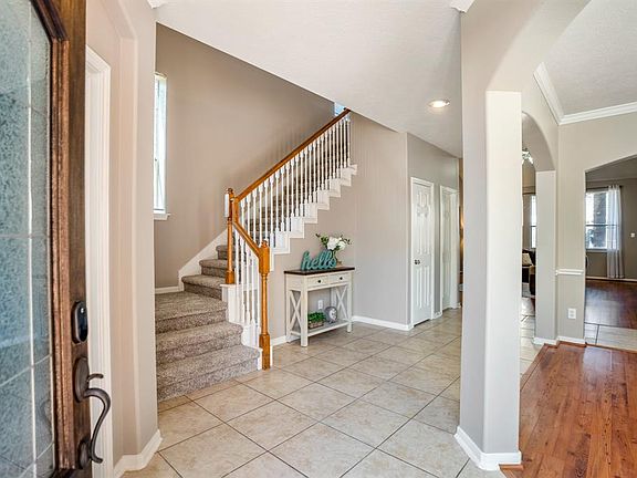 Without further ado, come on in! The foyer immediately opens to the staircase leading to the second floor, the formal dining room on the right, & spacious living room beyond.