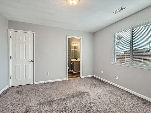 Master bedroom with walk-in closet and full bathroom