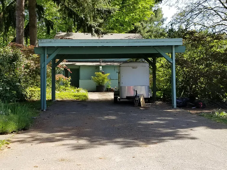 Carport view from street. Left side is for unit.