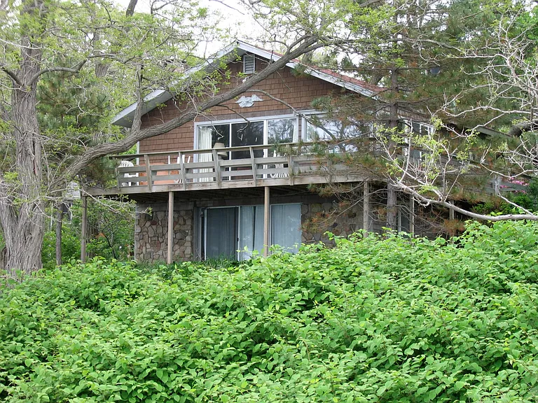 View from the water (pines on both sides of the deck are gone now)
