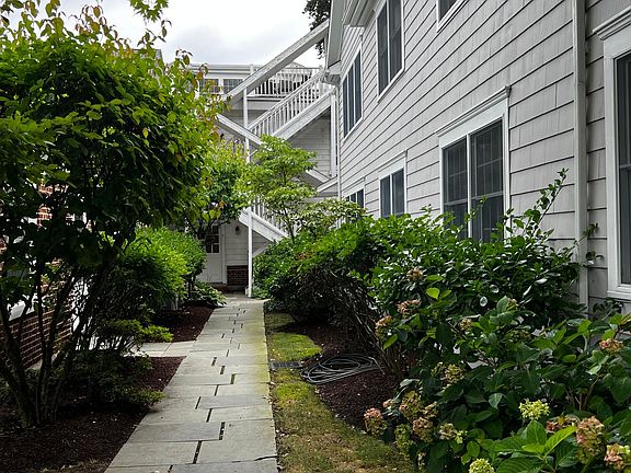 Path to Unit, directly next to parking lot at rear of building. No street noise