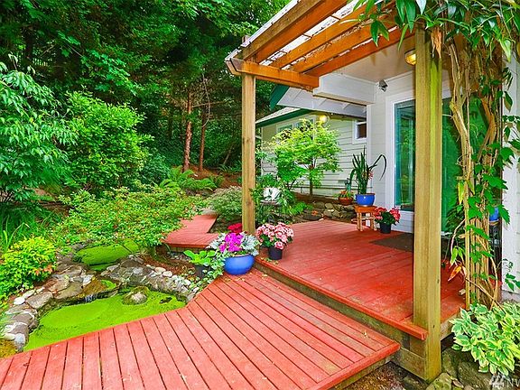 Custom walk-ways, gurgling ponds, beautiful landscaping. Look for the fish in the pond.