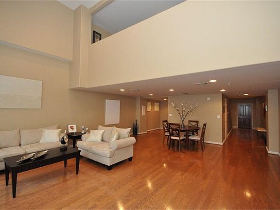 The bedroom has a half-open wall loft-style, but with fully finished features. The ceilings measure 