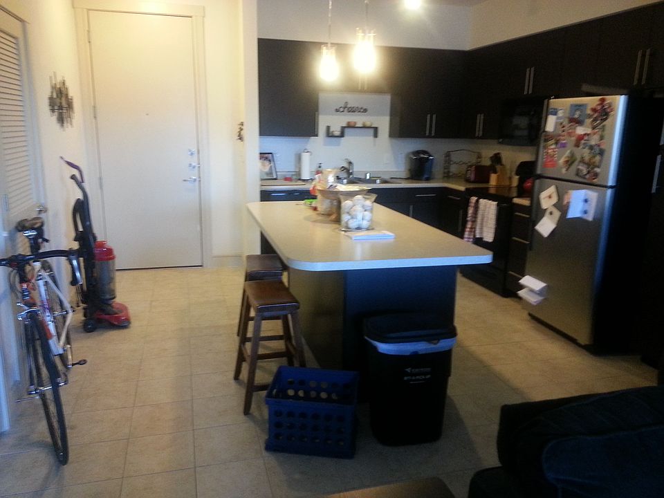 View of the door and kitchen from the living room